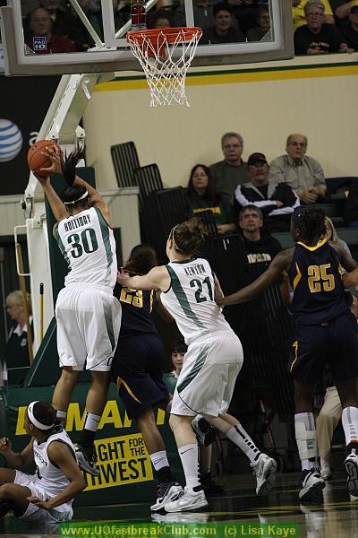 Holliday getting one of her 10 rebounds and avoiding landing on Jackson.